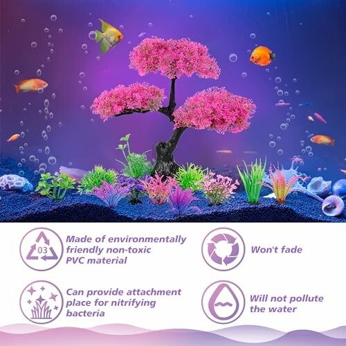 Aquarium decoration with pink bonsai tree and colorful fish