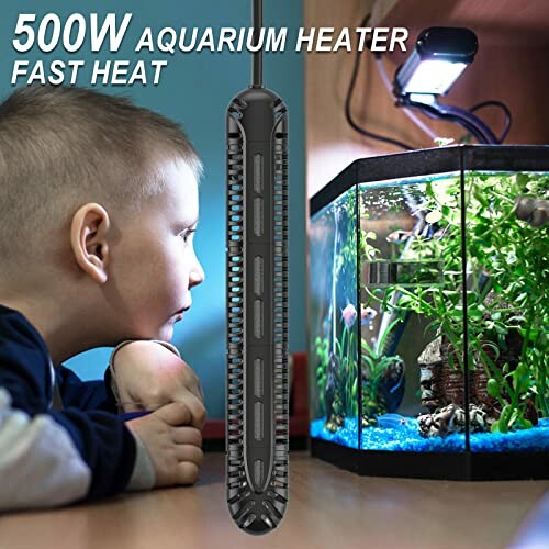 Child watching fish in aquarium with heater and light.