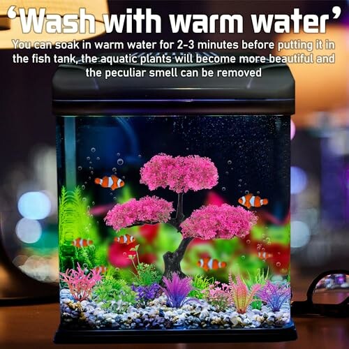 Aquarium with pink coral tree and clownfish