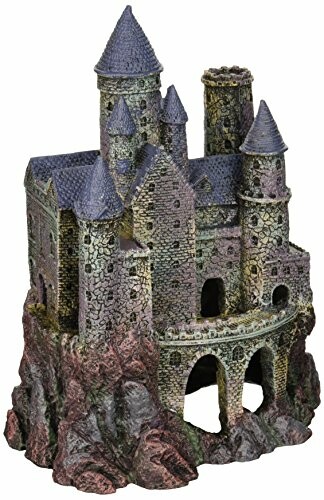 Decorative medieval castle figurine with turrets and stone walls.